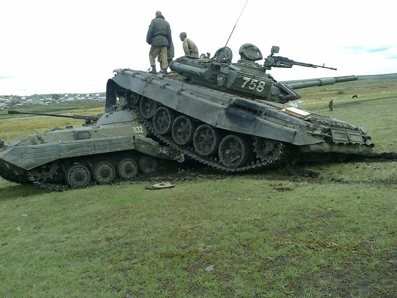 Russian+military+a+T-72+main+battle+tanks+participating+in+the+exercise+of+a+sudden+lost+control+and+crashed+into+one+of+BMP-2+fighting+vehicles.++%25284%2529.jpg
